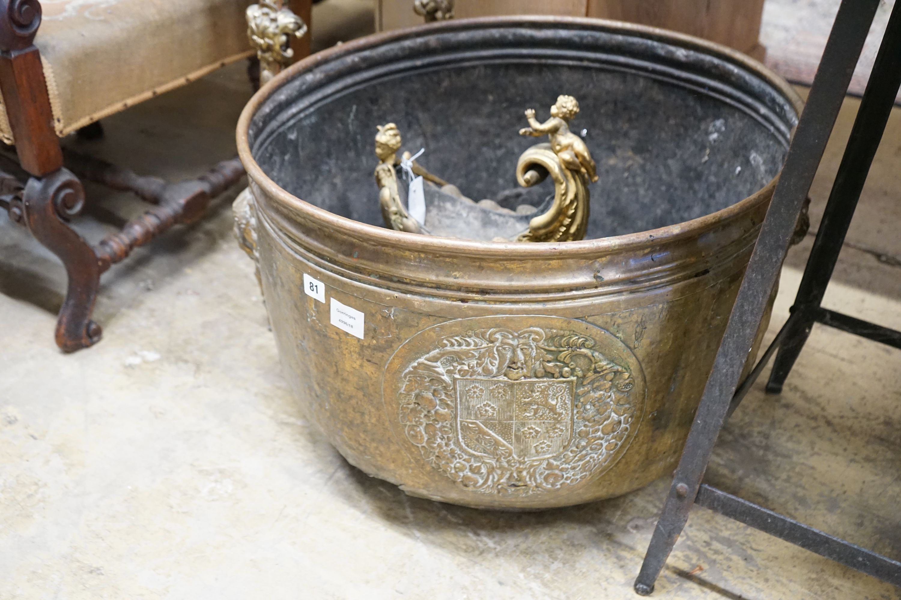 A large Dutch embossed brass circular log bin, diameter 63cm together with a gilt metal cornucopia centrepiece